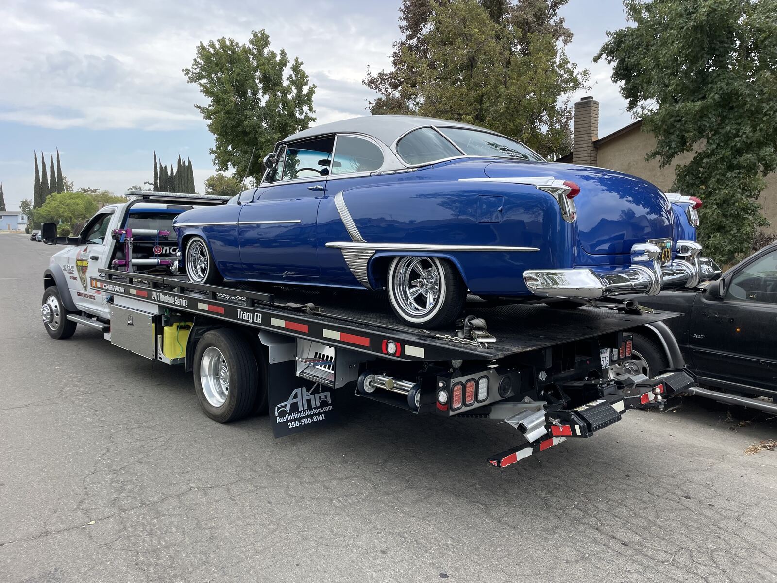 Classic car towing Tracy CA - Oldsmobile on flatbed tow truck