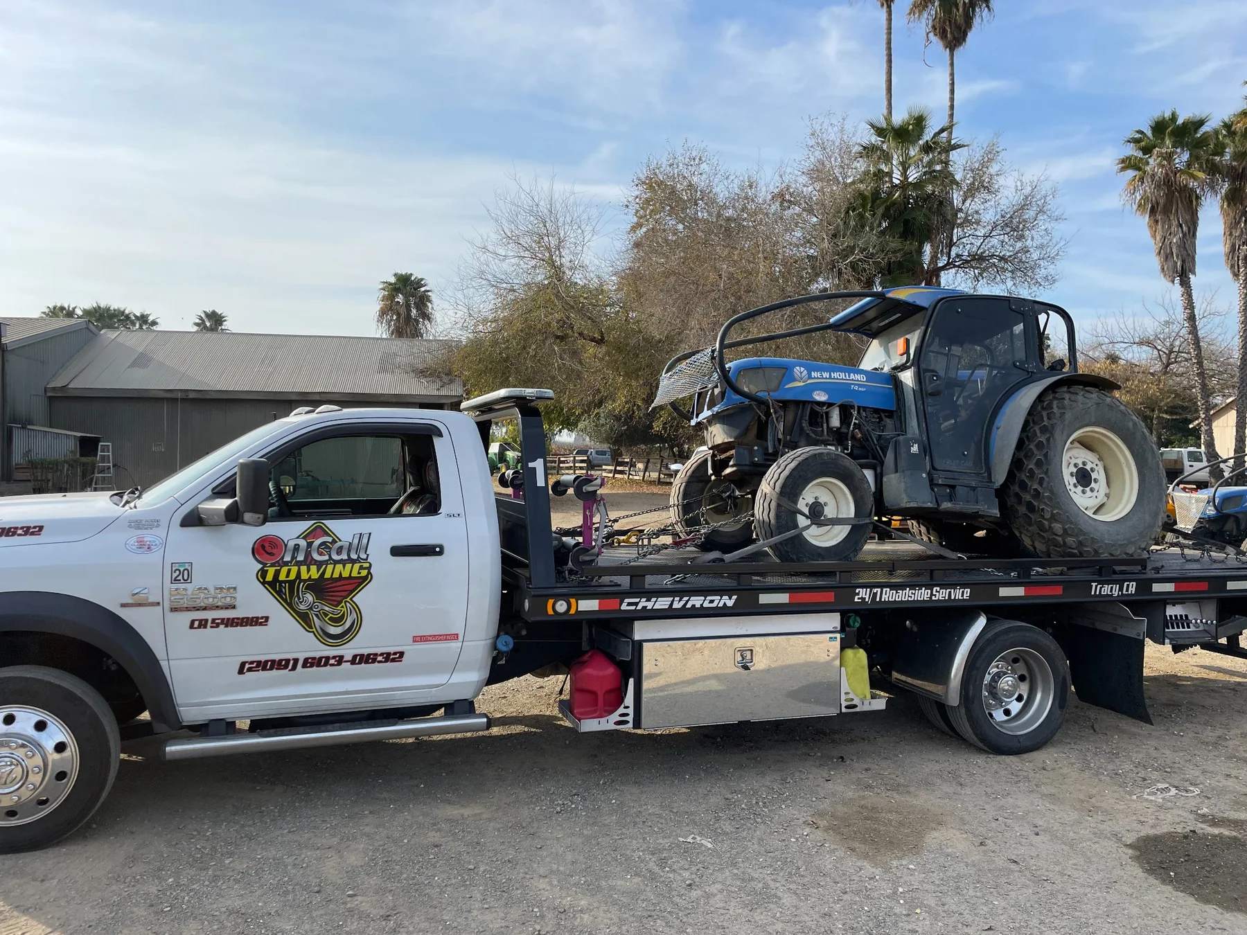 Tractor and equipment transport by Oncall Towing INC near Tracy California