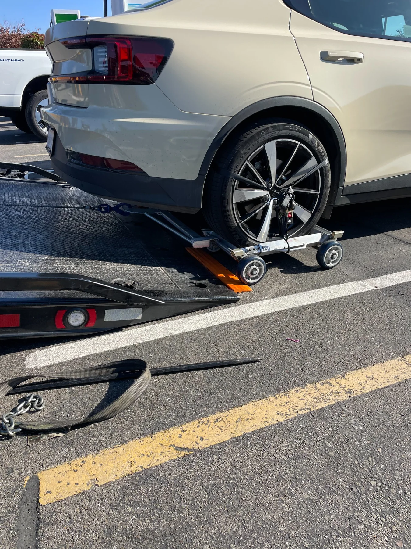 Wheel dolly loading for careful vehicle transport